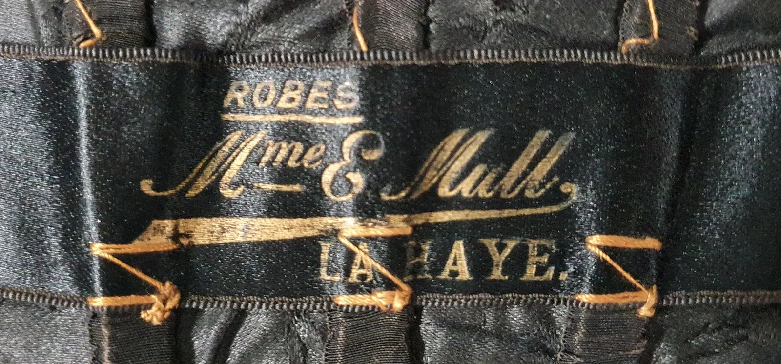 Label van Madame E. Mull