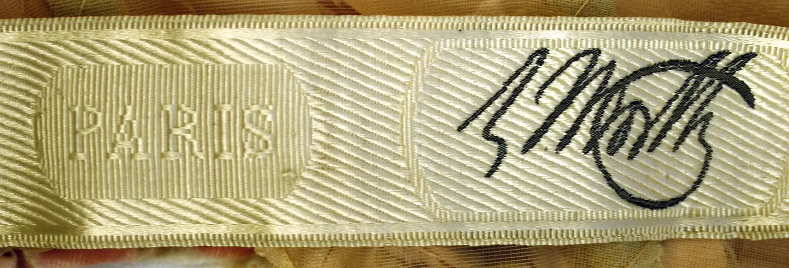 Label van House of Worth